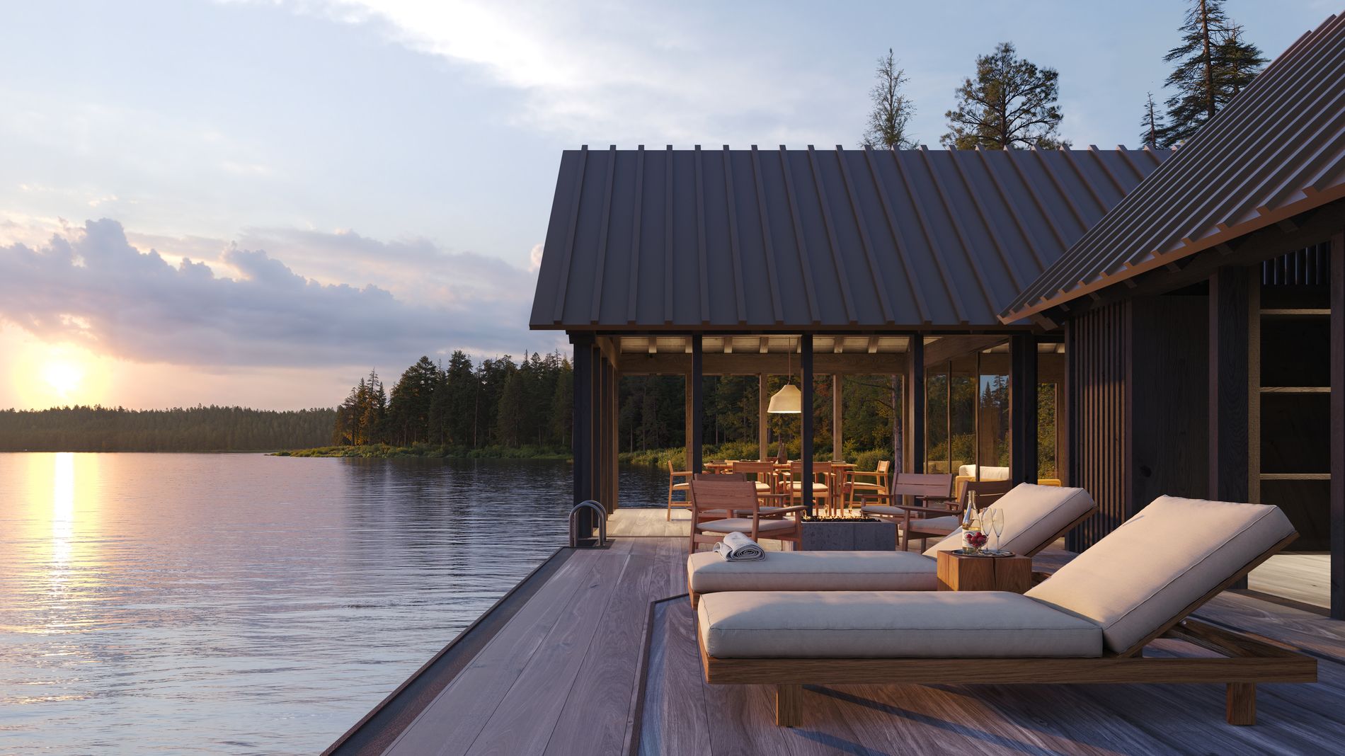 Waterfront boathouse deck with lounge seating at sunset
